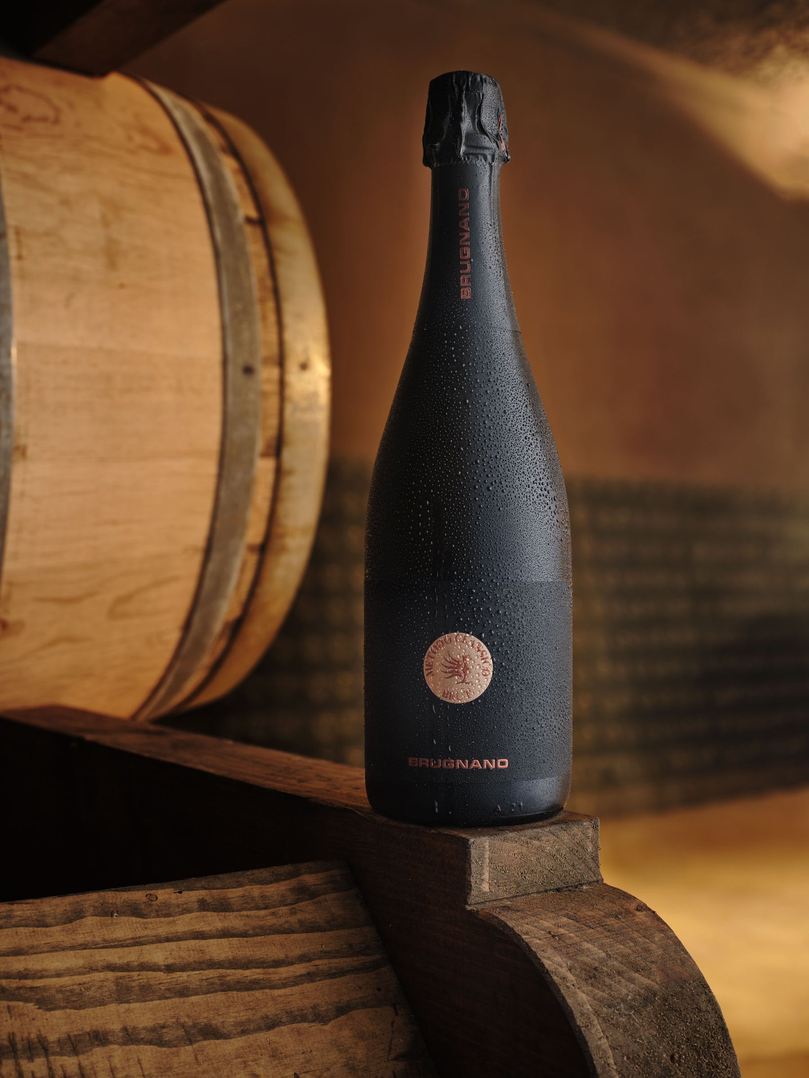 The Brugnano Metodo Classico on a barrel, in warm backlight