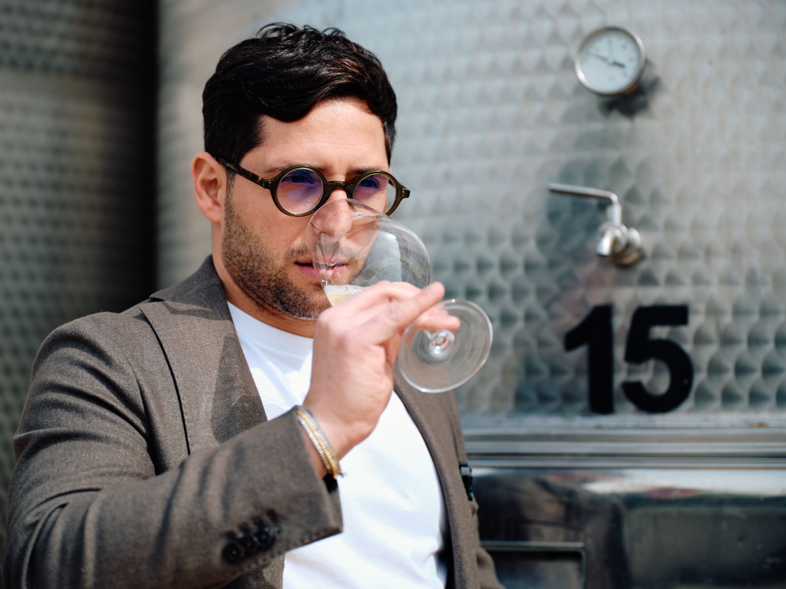 The tasting, in front of the steel tanks