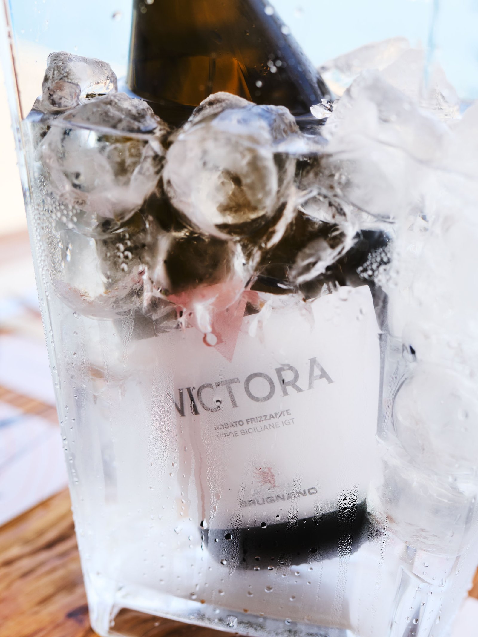 Victora in the bucket packed with ice, condensation on the glass