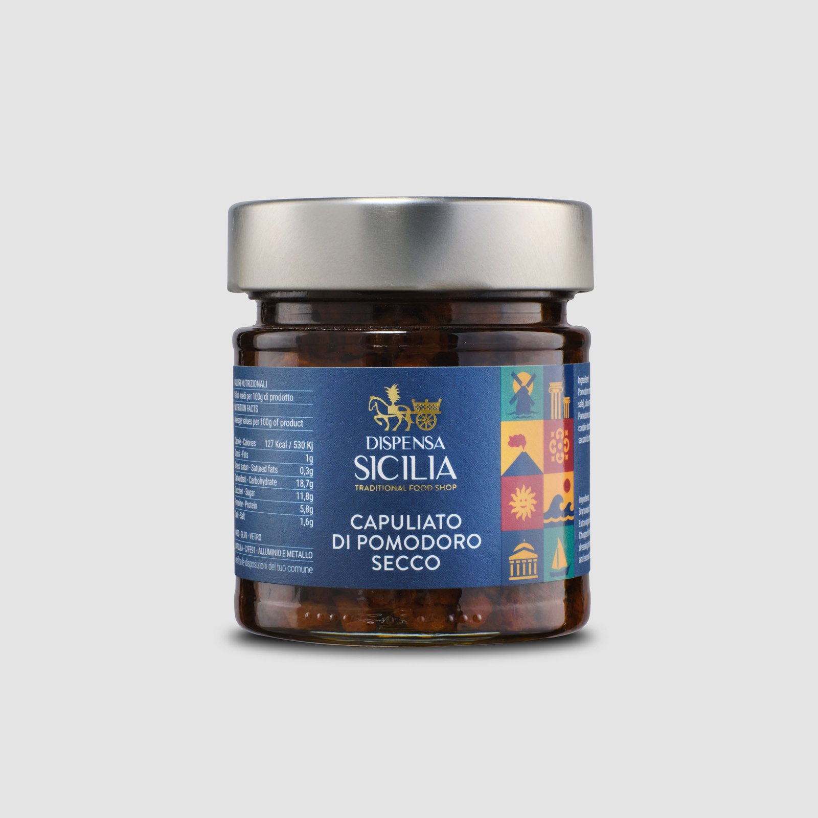 Dispensa Sicilia chopped dried tomato in a glass jar, on a light background